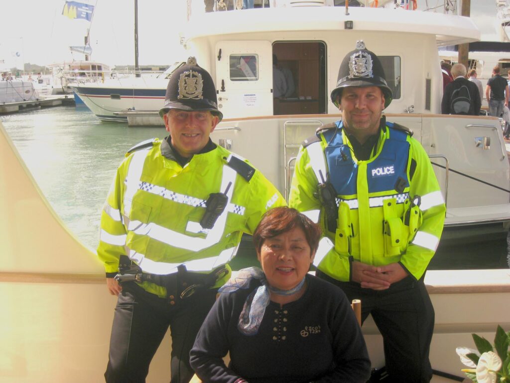 Friendly British coppers at Southampton boat show with Louisa from Taiwan.