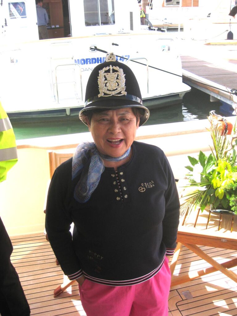 Louisa wearing a cop's helmet.